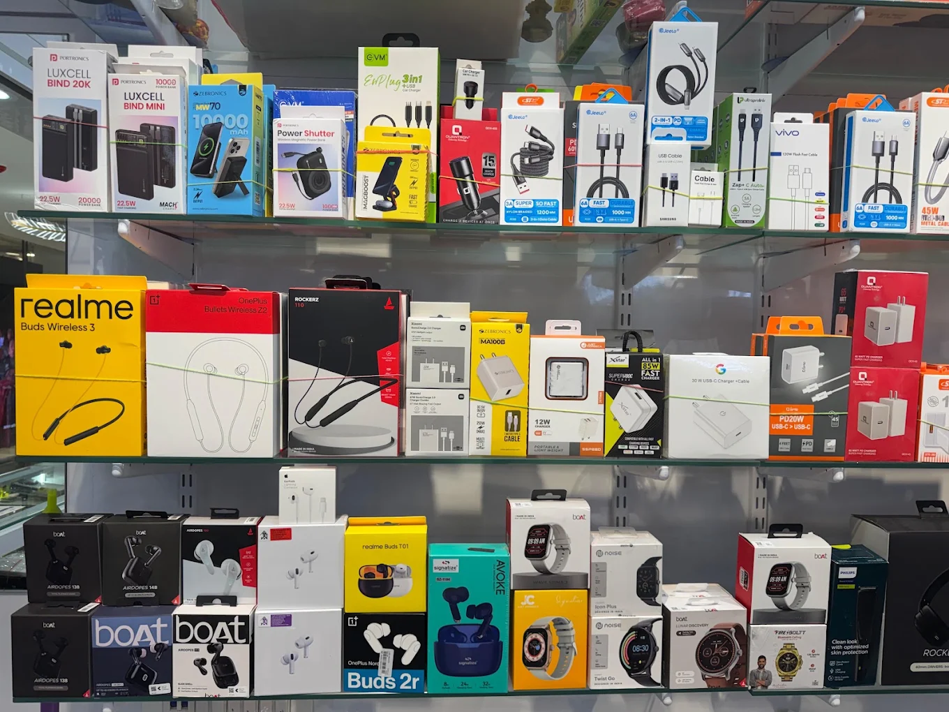 MR Gallery product shelves with chargers, earbuds and smart accessories